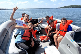 boys on a speedboat